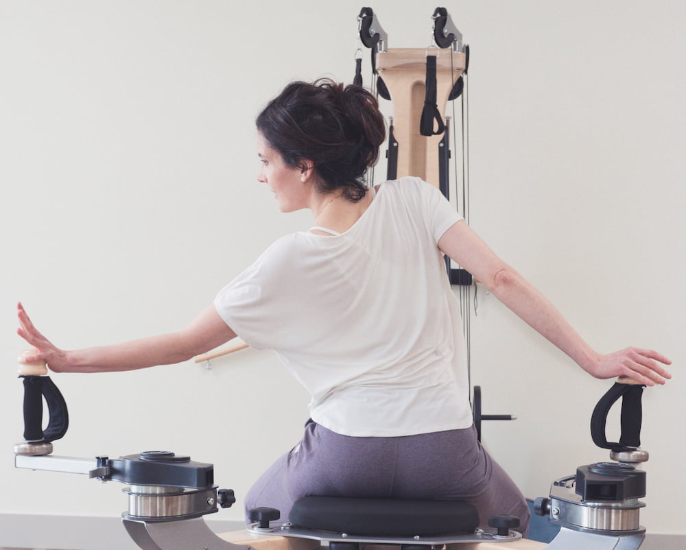 Leslie using a gyrotonic machine